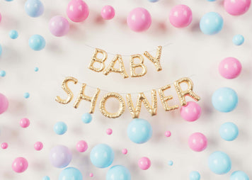 Best Baby Shower Gifts: Why Gift Personalized Minky Blankets? Baby shower decorations with colorful balloons and banners.