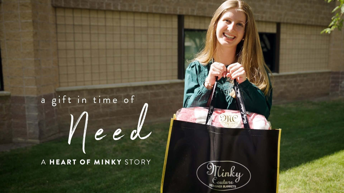 A young woman smiling and holding a bag with blankets, representing the Heart of Minky Story - Called to Help.