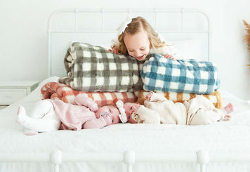 10 Fun Baby Shower Games to Make All of Your Guests Feel Included with cozy blankets and happy babies.