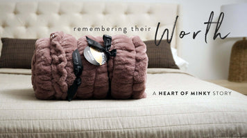 Heart of Minky Story - Remembering Their Worth with plush blankets on a stylish bed.