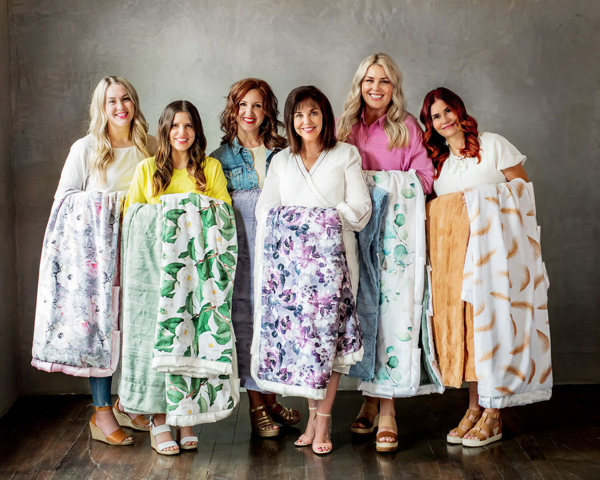 25 Mother's Day Quotes to Celebrate Women with Minky Couture's talented team showcasing beautiful blankets.
