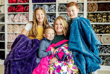 Minky Couture Mother's Day Gift Guide - Family enjoying cozy Minky blankets in various colors.
