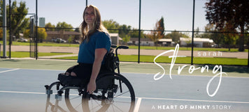 Sarah Strong smiling in her wheelchair on a court, celebrating resilience in the Heart of Minky Story - Sarah Strong.