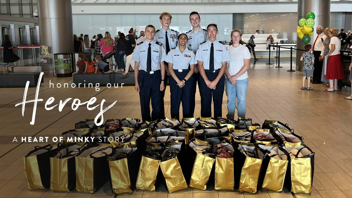 Heart of Minky Story - Honoring our Heroes featuring volunteers with donation bags at an event.