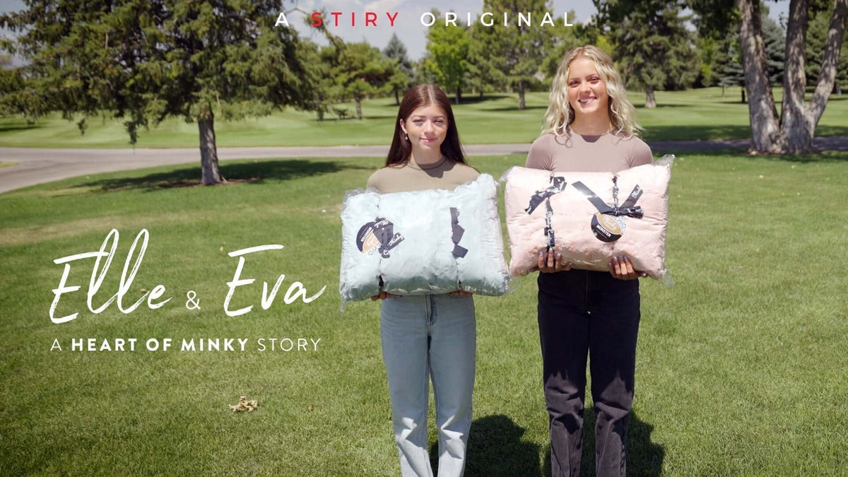 Elle & Eva holding cozy blankets in a beautiful park setting - A HEART OF MINKY STORY.