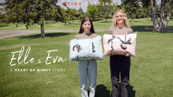 Elle & Eva holding cozy blankets in a beautiful park setting - A HEART OF MINKY STORY.