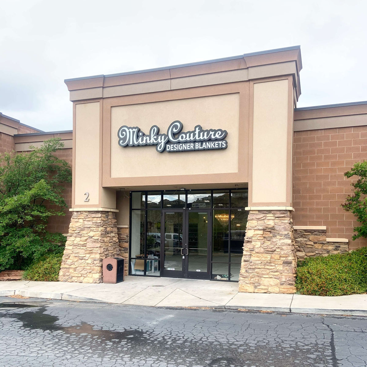 Minky Couture designer blankets store entrance in St. George, UT showcasing the stylish exterior and signage.