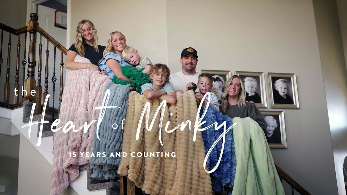 Heart of Minky Story - 15 Year Highlight Story featuring families together with Minky blankets on staircase.
