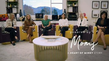 A group of six women showcasing teamwork in a stylish setting, highlighting the Heart of Minky Story - Powered by Moms.