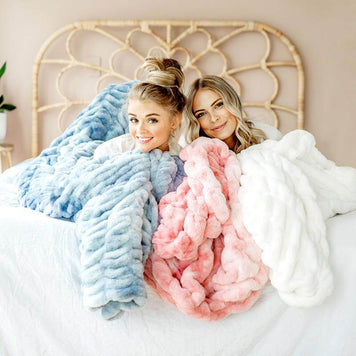 QUIZ: Are You The Ultimate Minky Couture Fan? Women cozying up with colorful Minky Couture blankets.