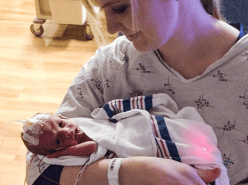 Heart of Minky: Hadlee, a mother holding her premature baby in the NICU.