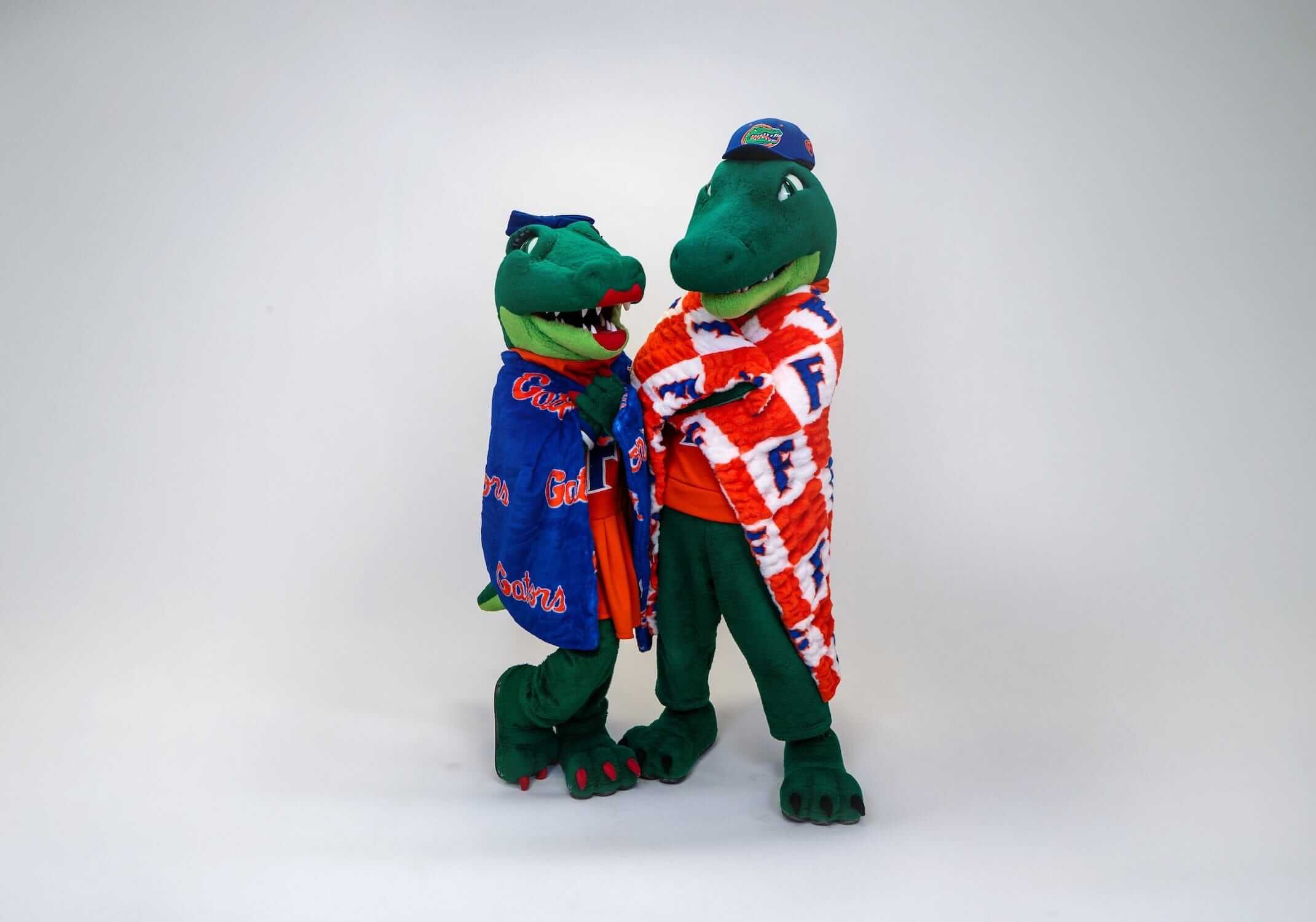 Florida Gators Blanket Lush mascot characters showcasing team spirit in blue and orange blankets.