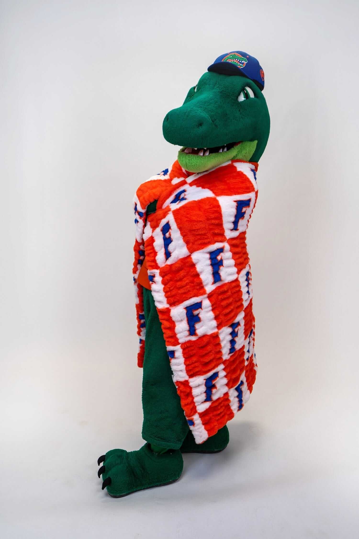 Hugs Florida Gators Blanket wrapped around a mascot wearing a cap and a joyful expression.