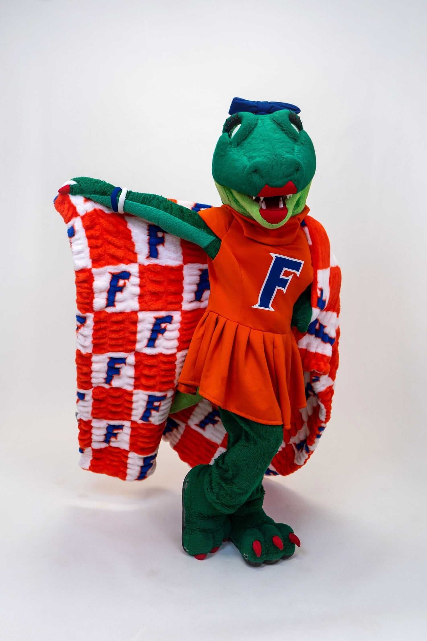 Florida Gators Blanket mascot wearing the blanket with an orange and white checkered pattern.
