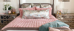 Ballet Rose Cloud Duvet set on a beautifully styled bed with blush pink pillows and elegant decor.