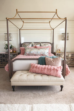 Ballet Rose Cloud Duvet displayed on a luxurious canopy bed with soft blush pillows and a cozy throw.
