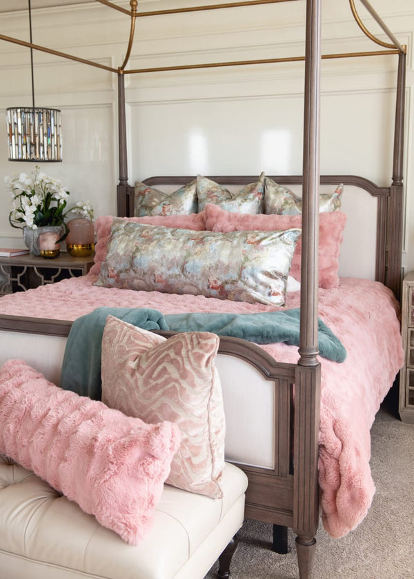 Ballet Rose Cloud Duvet on a luxurious bed with plush pillows and throws in a serene bedroom setting.