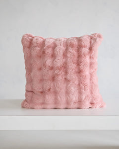 Ballet Rose Cloud Sham in soft blush color on a minimalist table, highlighting its plush texture and elegant design.