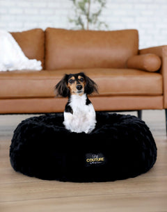 Minky Couture Black Crinkle Pet Bed cover with a dog relaxing on it in a cozy living room setting.
