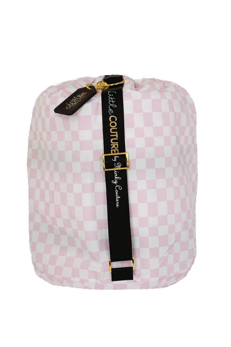Pink Check Sleeping Bag, rolled up with pink checkered pattern and black strap, perfect for travel and storage.