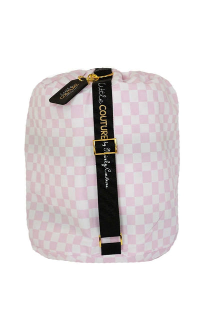 Pink Check Sleeping Bag, rolled up with pink checkered pattern and black strap, perfect for travel and storage.