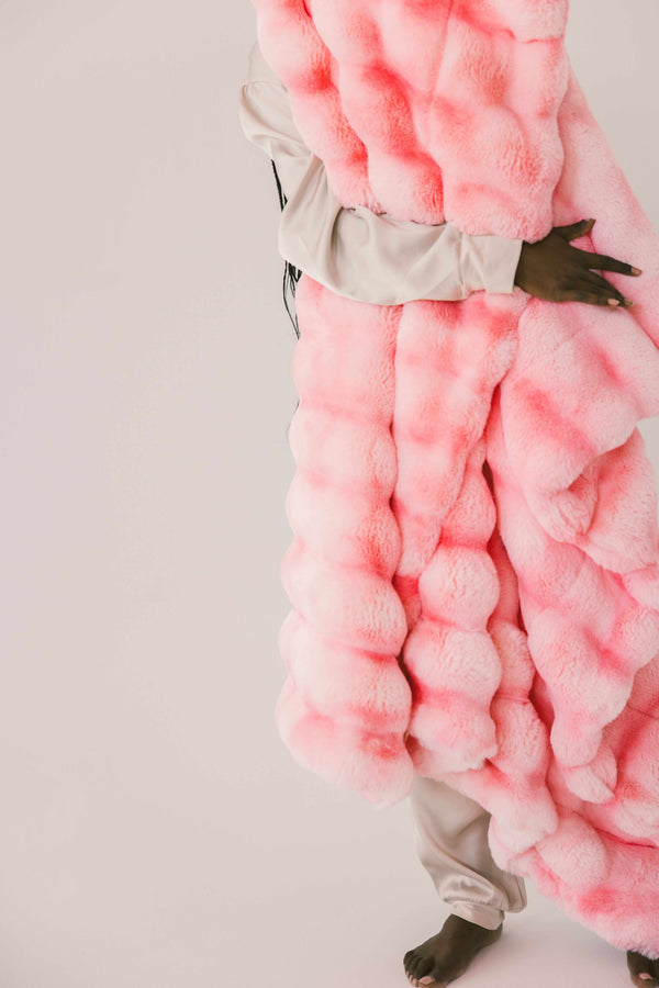 Extreme Ultra Cloud Pink Lemonade Blanket displayed in a vibrant hot pink hue, showcasing its plush texture and cozy design.