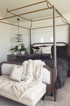 A beautifully styled bedroom featuring the Charcoal Cloud Duvet on a four-poster bed, creating a cozy and sophisticated atmosphere.