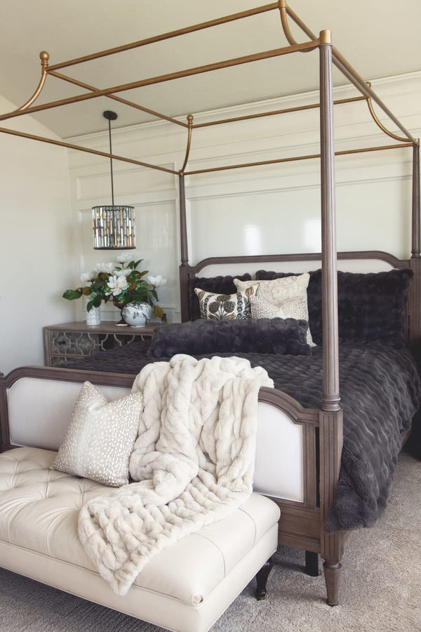 A beautifully styled bedroom featuring the Charcoal Cloud Duvet on a four-poster bed, creating a cozy and sophisticated atmosphere.