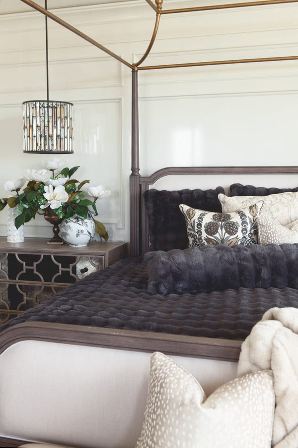 Charcoal Cloud Sham on a beautifully styled bed with textured pillows and elegant decor.