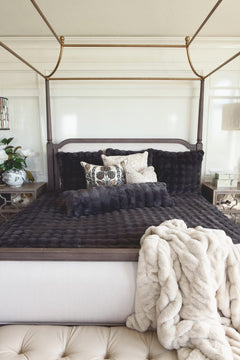 Stylish bed featuring the Charcoal Cloud Duvet with plush blankets and decorative pillows for a modern retreat.