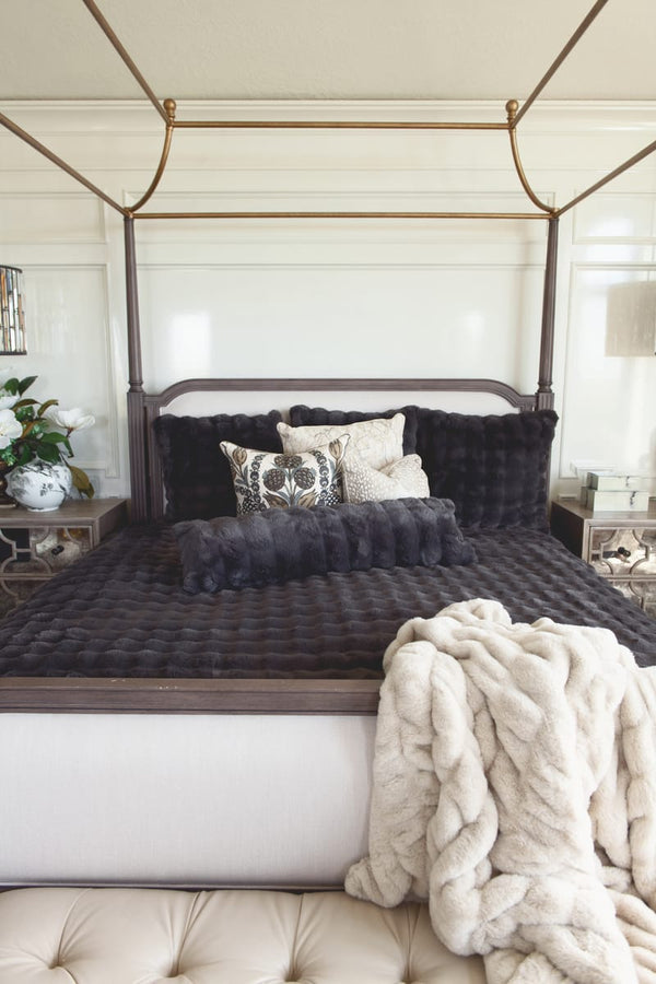 Stylish bed featuring the Charcoal Cloud Duvet with plush blankets and decorative pillows for a modern retreat.