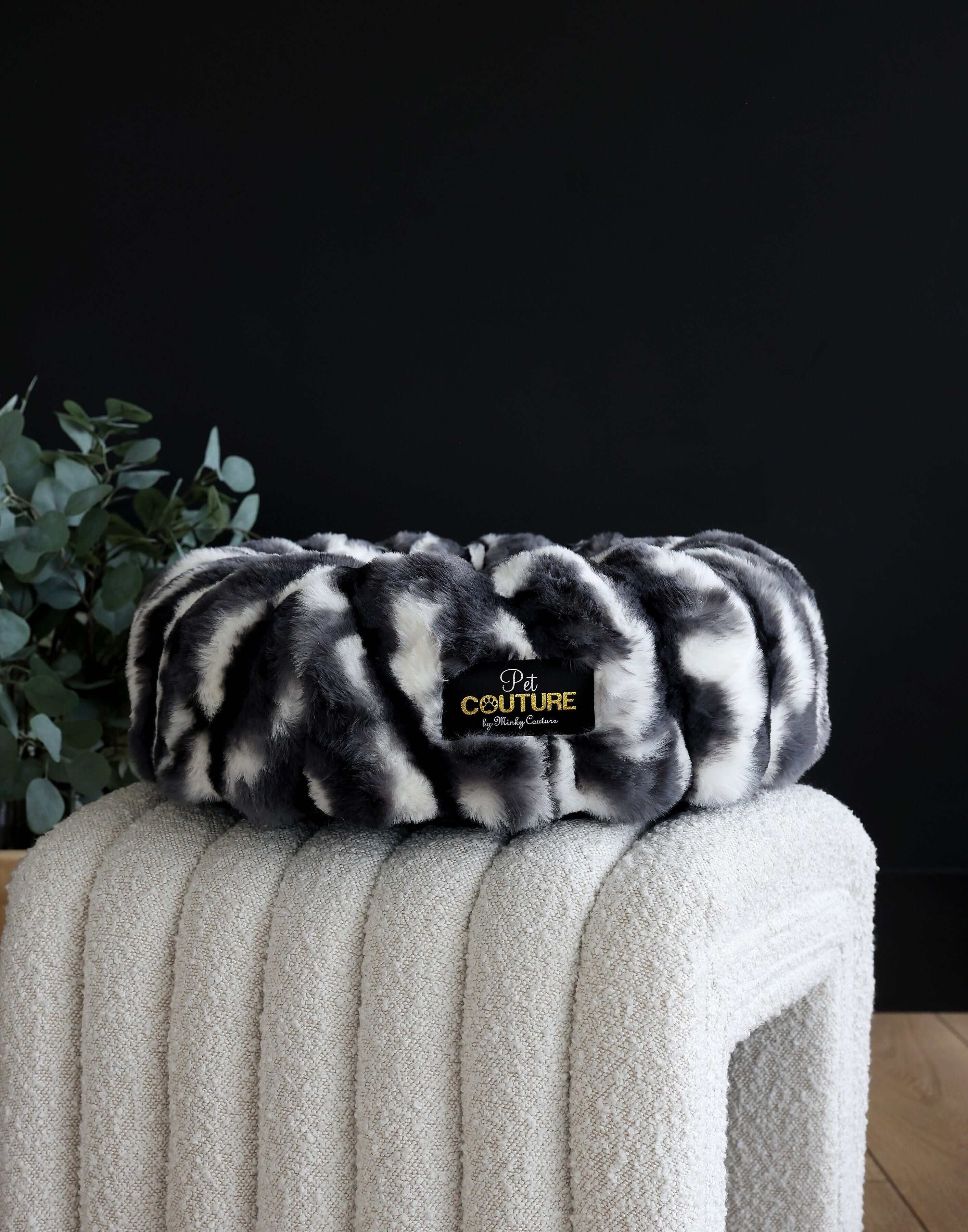 Minky Couture Cloudy Day Black Pet Bed cover placed on a modern cream pet bed.