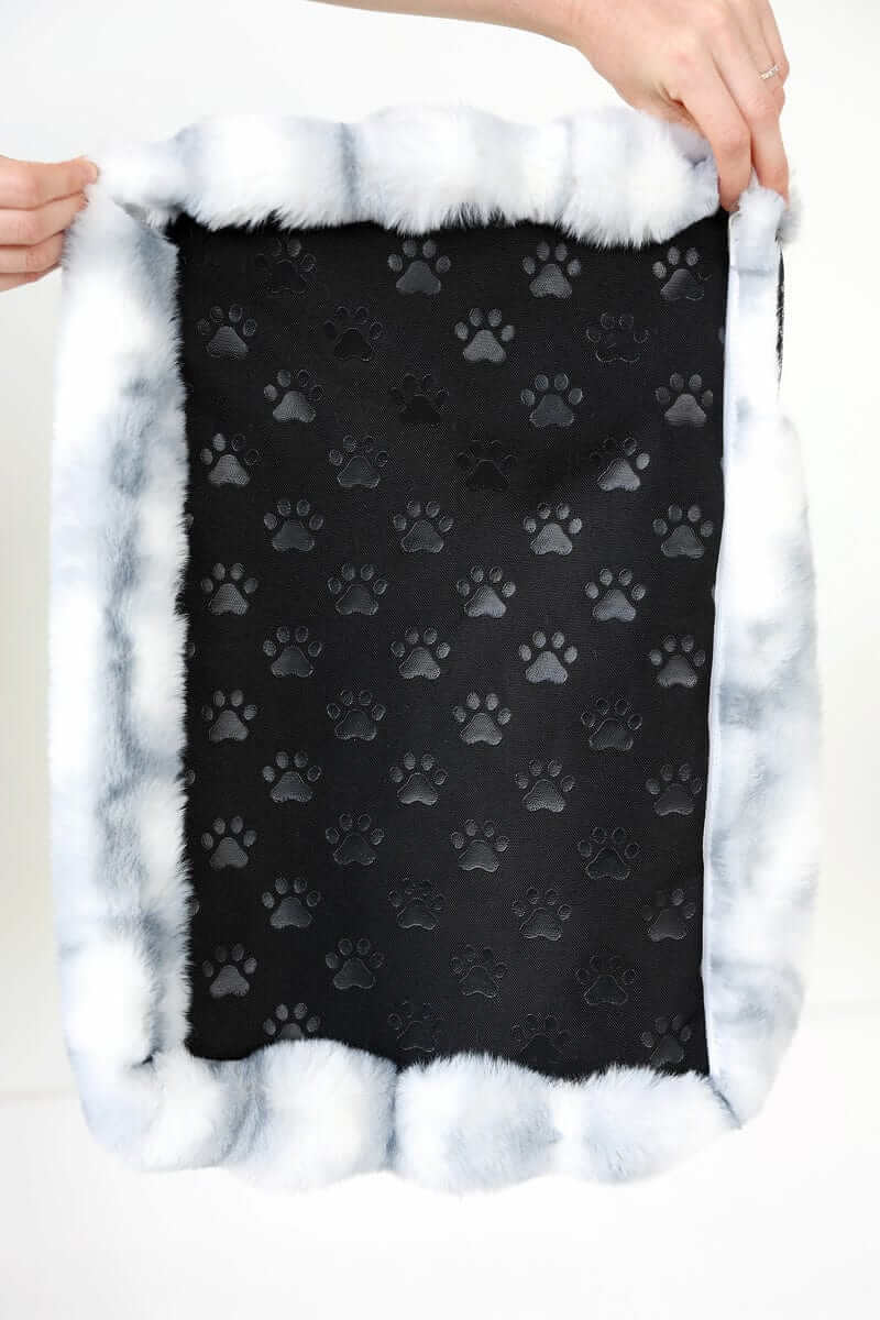 Cloudy Day Blue Pet Crate Pad cover with paw print design and plush border.