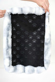 Cloudy Day Blue Pet Crate Pad cover with paw print design and plush border.