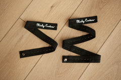 Minky Keepers: set of two black straps designed for rolling and securing blankets.
