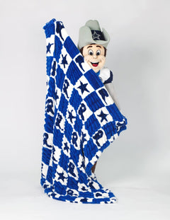 A Dallas Cowboys mascot holding up a large blue and white checkered blanket with star and cowboy boot pattern.