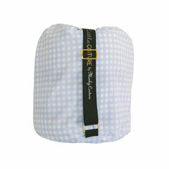 Sleeping Bag Dusty Blue Gingham rolled and secured with black strap for easy storage and transport.