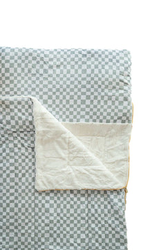 Sage Check Sleeping Bag featuring a cozy checkered pattern and soft plush lining for comfort and warmth.