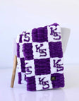 Purple and white Minky Couture Kansas State Wildcats blanket with “KS” checkerboard pattern.