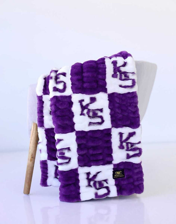 Purple and white Minky Couture Kansas State Wildcats blanket with “KS” checkerboard pattern.