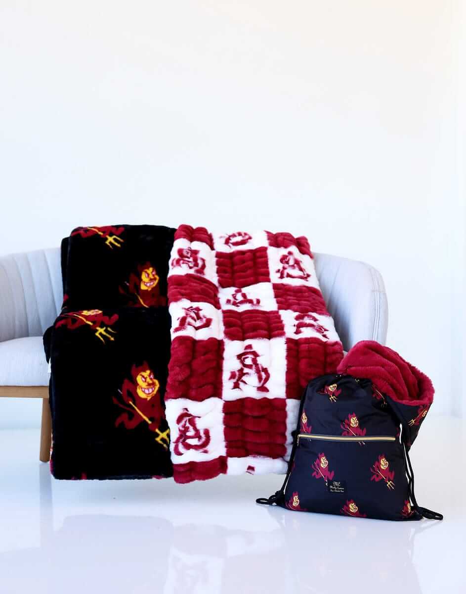 Black and red Minky Couture Arizona State Sun Devils blankets and a matching bag.