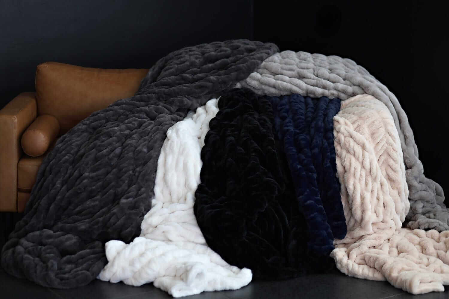 Walker Kessler Biggest Hugs Blankets draped over a couch, showcasing its oversized cozy design.