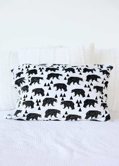 My Bear Blanket decorative pillow with geometric black bears and triangles on a cream background.