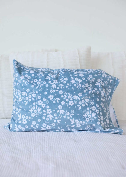 Dainty Floral Blue Blanket with small white flowers on a light blue background, perfect for cozy decor.