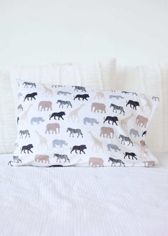 Safari Blanket pillow featuring animal silhouettes in neutral tones on a white background.