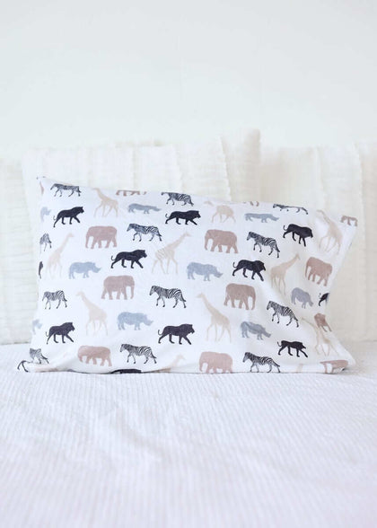 Safari Blanket pillow featuring animal silhouettes in neutral tones on a white background.