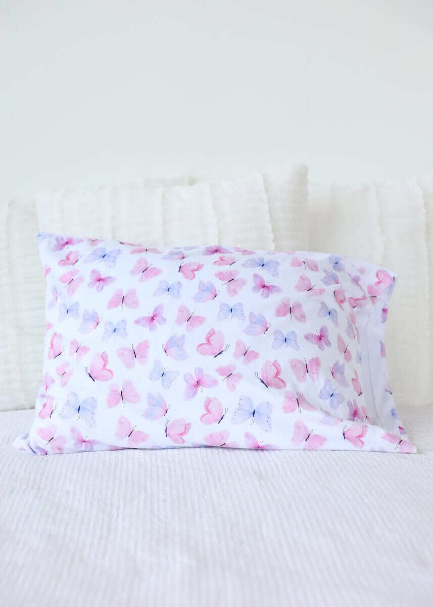 Pastel Butterfly Blanket with pink and lilac butterflies on a white background, perfect for a cheerful decor.