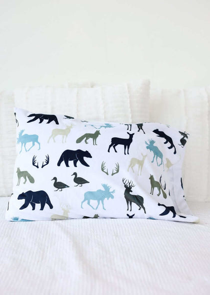 Teton Mist Blanket featuring woodland animals like moose, bears, and ducks on a white background.