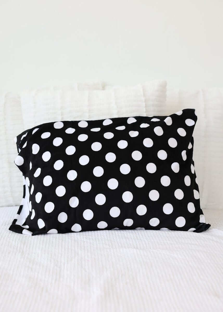 Happiest Blanket featuring white polka dots on a black background, perfect for stylish comfort.