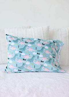 Ms. Dino Blanket with blue and pink dinosaur pattern on light blue fabric, featuring a plush backing and satin ruffle.